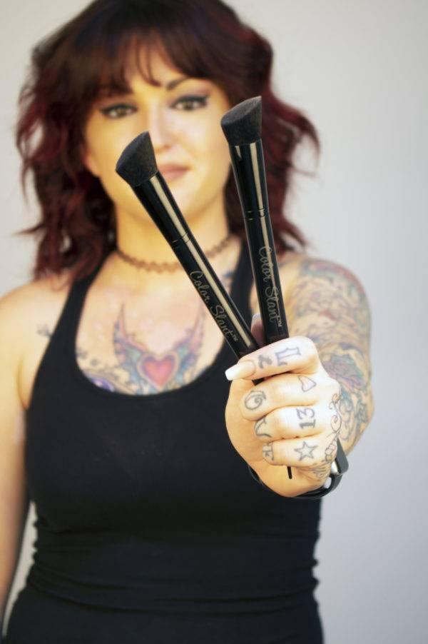 Women holding several hair color brush